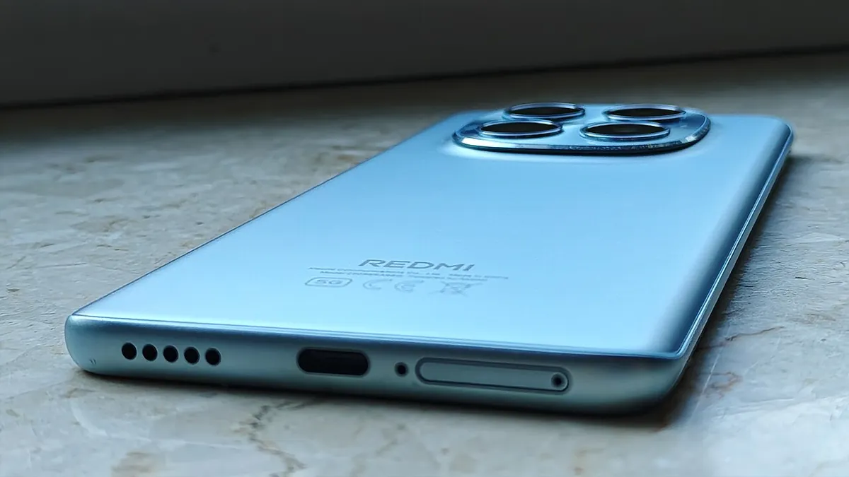 Bottom edge of an Android phone showing the mic holes and USB-C port